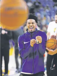  ?? Michael Macor / The Chronicle ?? Quinn Cook, the Warriors’ G-League affiliate’s point guard, warms up Friday at Oracle Arena. He will play with the NBA team when needed, otherwise will be on the Santa Cruz squad.
