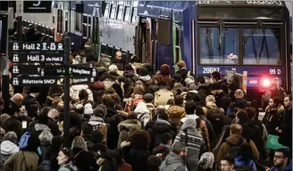  ??  ?? Travellers walk on a platform at the Gare de Lyon railway station in Paris on the 16th day of a nationwide multi-sector strike against the government’s pensions overhaul. — AFP photo