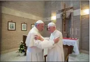  ?? L'OSSERVATOR­E ROMANO — POOL PHOTO VIA AP ?? Pope Francis, left, embraces Pope Emeritus Benedict XVI in 2017. Some Vatican watchers believe Benedict's recent death worsens Francis' exposure to conservati­ve critics.