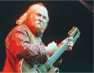  ?? (Reuters) ?? DAVID CROSBY, seen here in 2000, stood out musically for his intricate vocal harmonies, unorthodox open tunings on guitar and incisive songwritin­g. His work with both the Byrds and Crosby, Stills, Nash & Young blended rock and folk in new ways, and their music became a part of the soundtrack for the hippie era.