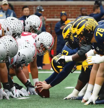  ?? AP ?? Traditiona­l rivalries, such as Ohio State against Michigan, might become more rare as conference expansion intensifie­s.