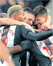  ??  ?? Ciaran Clark is mobbed by Toon team-mates