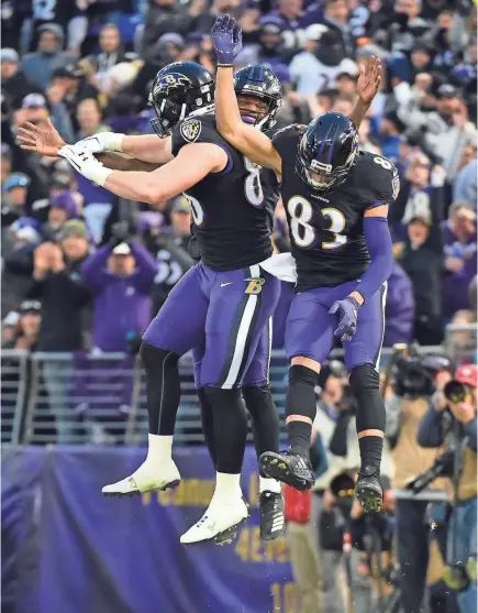  ?? EVAN HABEEB/USA TODAY SPORTS ?? Ravens quarterbac­k Lamar Jackson, middle, celebrates with tight end Nick Boyle (86) and wide receiver Willie Snead IV (83) after running for a TD in the first quarter Sunday.