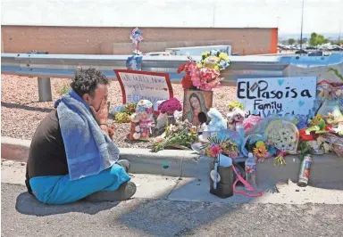  ?? MICHAEL CHOW/THE REPUBLIC ?? Felipe Avila mourns outside Walmart in El Paso, Texas, on Sunday. Twenty people were killed and more than two dozen were injured in a mass shooting at the shopping center on Saturday.