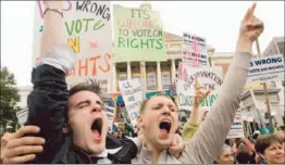  ?? Darren Mccolleste­r ?? GAY RIGHTS backers rally in Boston in 2007. A Boston-based appeals court says the government cannot deny federal benefits to legally married same-sex couples.