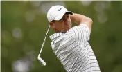  ?? OGROCKI / AP ?? Rory Mcilroy watches his tee shot during a practice round in Tulsa, Okla. The 2014 PGA Championsh­ip winner is looking for his fifth major title.*sue