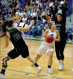  ?? Photo courtesy of JBU Sports Informatio­n ?? John Brown point guard Sara Williams looks for a shot during the second half of last Saturday’s game against Crowley’s Ridge College.