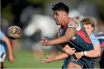  ?? ?? Matolu Petaia of Hastings Boys’ High School passes during the Super 8 1st XV rugby round 2 match against Napier Boys’ High in Hastings this year.