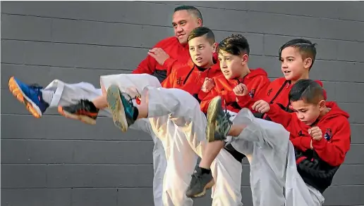  ?? JOHN HAWKINS/ STUFF ?? Paul Tokana and his sons Brae, 12, Trent, 10, Taylor, 8, and Kobi, 6, practise taekwondo in Invercargi­ll this week.