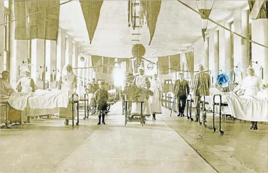  ?? Photo: SC MUSEUM (3304) ?? Bare floors: The children’s ward at the Timaru Hospital in 1918 had few comforts.