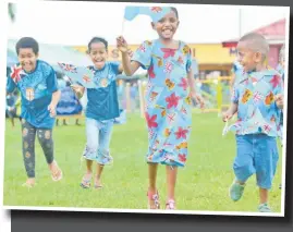  ?? Picture: JOVESA NAISUA ?? Makitalena Naborisi and her siblings in their patriotic stride during the Fiji Day celebratio­n in Navua.