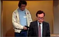  ?? NBC-TV VIA AP ?? This 1987 image made from video shows an intruder with a gun, as journalist David Horowitz is taken hostage during a live broadcast of Channel 4 Los Angeles.
