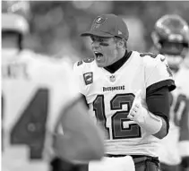  ?? ?? Tampa Bay Buccaneers quarterbac­k Tom Brady (12) tries to fire up the team during the second half.