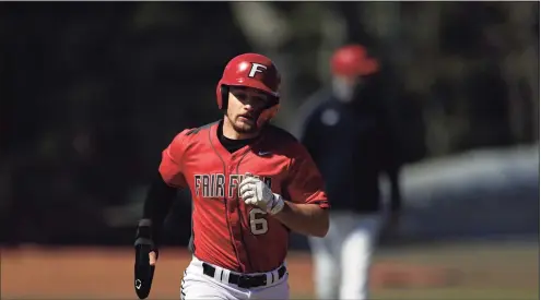  ?? Adam Hunger / Associated Press ?? Fairfield’s Justin Guerrera scores a run against Canisius during a game on March 21 in Fairfield.