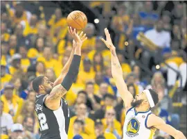  ?? NHAT V. MEYER – STAFF PHOTOGRAPH­ER ?? The Warriors’ Javale McGee, right, defends against San Antonio’s LaMarcus Aldridge during the third quarter of Saturday’s first-round Western Conference playoff game.