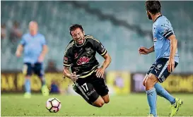  ?? PHOTO: GETTY IMAGES ?? Wellington Phoenix midfielder Vince Lia feels the pain of a tackle from a Sydney FC player on Thursday night.