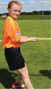  ?? Photo by Sheila Fitzgerald. ?? Olivia Carter and Emma Lehane, Rathcoole, going head to head in the tug ‘o’ war at the Dromtariff­e Kellogg’s GAA Cúl Camp.