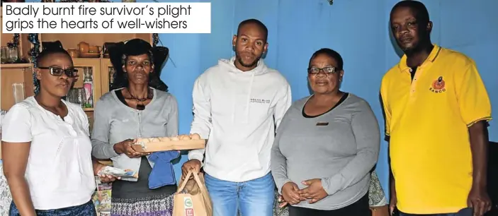  ?? Picture: TK MTIKI ?? LENDING A HAND: Good Samaritans met at Vuyolwethu Cotsheni’s home after he survived a fire that burnt a home to ashes and took two lives. From left are community developmen­t worker Nollie Mani, mother of the fire victim Ntambomzi Cotsheni, Nemato Car Wash member Siya Melani, Child Welfare representa­tive Lizzy Sandlana and Ward 9 Councillor Mbulelo ‘Stwiga’ Njibana. They are all lending a hand to make life a little easier for the young victim