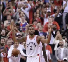  ?? NATHAN DENETTE - THE ASSOCIATED PRESS ?? Kawhi Leonard celebrates the Raptors’ victory over the Bucks Sunday night.