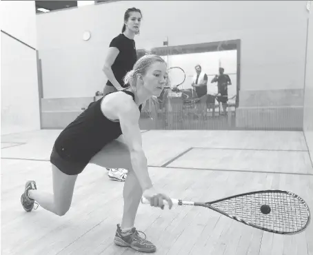  ?? NICK BRANCACCIO ?? Danielle Letourneau, front, and Samantha Cornett hit the squash court at the Windsor Squash and Fitness Club on Monday in preparatio­n for this week’s Cienna Canadian Team Championsh­ips.
