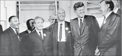  ?? Three Lions ?? THE REV. Martin Luther King Jr., from left, Rabbi Joachim Prinz, A. Philip Randolph and President Kennedy on Aug. 28, 1963, the day of the March on Washington, at which Prinz gave his own extraordin­ary speech, “Silence.”