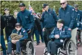  ?? JEREMIAS GONZALEZ/AP ?? U.S. veterans and family members attend the 78th anniversar­y of D-Day ceremony in the Normandy American Cemetery and Memorial of Colleville-surMer, France, on Monday.