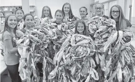  ?? [WHITNEY NEILSON / THE OBSERVER] ?? The WE Team at Wellesley Public School are making 10 milk bag beds to be sent to people in other countries through MILKBAGSun­limited. They spent the previous school year collecting 5,000 milk bags. Back row: Ashley MacGillivr­ay, Leah McDonald, Heidi...