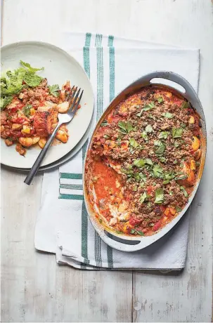  ??  ?? Fish pie with parmesan crumble from Eat To Save The Planet by Annie Bell. Photo: Pan Macmillan/PA