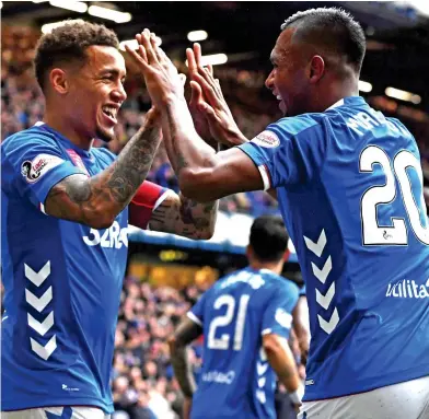  ??  ?? Hands off: James Tavernier (left) led Rangers past previously-unbeaten Hearts on Sunday