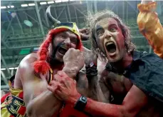  ?? — Reuters ?? Belgium fans celebrate after their team’s quarterfin­al win over Brazil. When their teams are not playing, many fans have explored Russia and enjoyed the host country’s cuisine.