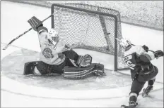  ?? GARY MANNING ?? Makail Parker fires the puck over the shoulder of Pictou County goalie Matt Normore Jan. 27 at the Apple Dome. The Valley Wildcats won the game 3-0 to remain in the playoff hunt.