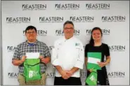  ??  ?? Chef Ben Vozzo from the Culinary Arts Institute at Montgomery County Community College presents awards to Hunter Meier, a senior in Eastern’s culinary arts program, and Jenna Painter, a junior in Eastern’s culinary arts program.