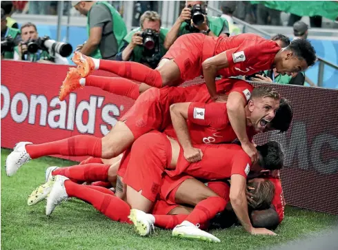  ?? AP ?? Somewhere under that pile of bodies is Harry Kane, mobbed by team-mates after scoring England’s late winner.