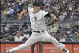  ??  ?? New York Yankees starting pitcher Masahiro Tanaka delivers the ball to the Los Angeles Angels during the second inning of a baseball game on Sunday, at Yankee Stadium in New York. AP PHOTO/BILL KOSTROUN