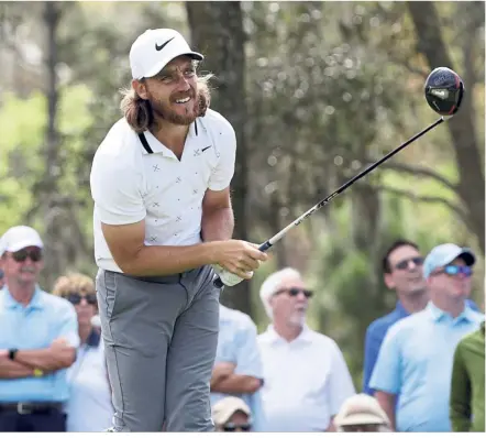  ??  ?? All eyes: Tommy Fleetwood watches his shot on the ninth hole during the first round of The Players Championsh­ip golf tournament in Ponte Vedra Beach on Thursday. — AP