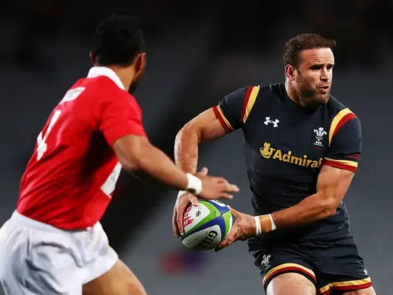  ??  ?? Jamie Roberts looks for the pass during his side's match against Tonga (Getty)