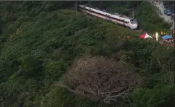  ?? XINHUA/ZUMA PRESS ?? A train derailed in Hualian, Taiwan on Friday. The death toll from the Taiwan train derailment has risen to 50, with 146 people rushed to hospital and no one still trapped at the accident site, according to local authoritie­s.