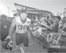  ?? Brett Coomer / Houston Chronicle ?? Local fans won’t have a chance to greet defensive end J.J. Watt as he makes his way to the practice fields because the Texans are camping in West Virginia.
