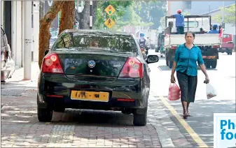  ??  ?? This car parked on the pavement forces pedestrian­s on to the main road, endangerin­g life and limb