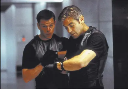  ?? Warner Bros. ?? Linus Caldwell (Matt Damon), left, and Danny Ocean (George Clooney) set out to break into the Bellagio vault in the 2001 box-office hit “Ocean’s Eleven.” In reality, no such room exists.