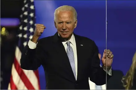  ?? ANDREW HARNIK — THE ASSOCIATED PRESS ?? President- elect Joe Biden gestures to supporters Saturday in Wilmington, Del.