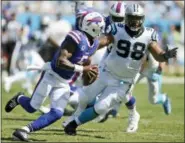  ?? THE ASSOCIATED PRESS ?? FILE - In this file photo, Buffalo Bills’ Tyrod Taylor (5) scrambles under pressure from Carolina Panthers’ Star Lotulelei.