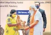  ?? PTI ?? PM Narendra Modi being presented a memento by L-G Tamilisai Soundarara­jan in Puducherry on Thursday.