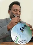  ?? ?? Dr. Khan with the 2014 FIFA World Cup Brazil football signed and gifted by the legendary and ‘the greatest’ footballer Pele.
