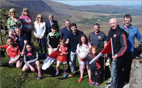  ??  ?? Kerry’s Paul Geaney launching St Pat’s GAA Club’s Dingle Way Challenge 2017 on the Conor Pass on Friday afternoon.