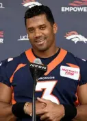  ?? Helen H. Richardson, The Denver Post ?? Broncos quarterbac­k Russell Wilson meets with members of the media on Monday.