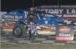  ?? RICH KEPNER FOR MEDIANEWS GROUP ?? Mike Gular stands in victory lane after his modified feature win at Grandview on July 19, 2020.