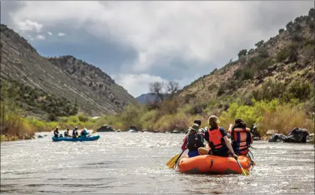  ?? NATHAN BURTON/Taos News file photo ?? Rafters float a placid section of the Rio Grande past the Racecourse near Pilar in March 2023, when an above-average snowpack began to melt in Northern New Mexico. Experts agree that a warming climate causes snowpacks to melt faster, leading to more intense river flows.