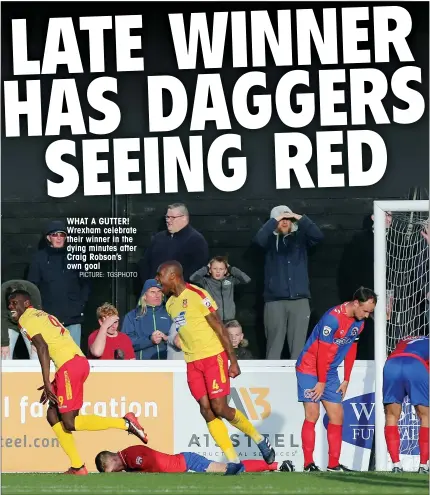  ?? PICTURE: TGSPHOTO ?? WHAT A GUTTER! Wrexham celebrate their winner in the dying minutes after Craig Robson’s own goal