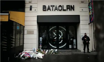  ?? Photograph: Benoît Tessier/Reuters ?? A police officer outside the Bataclan concert hall where three gunmen killed 90 people at a gig in November 2015.